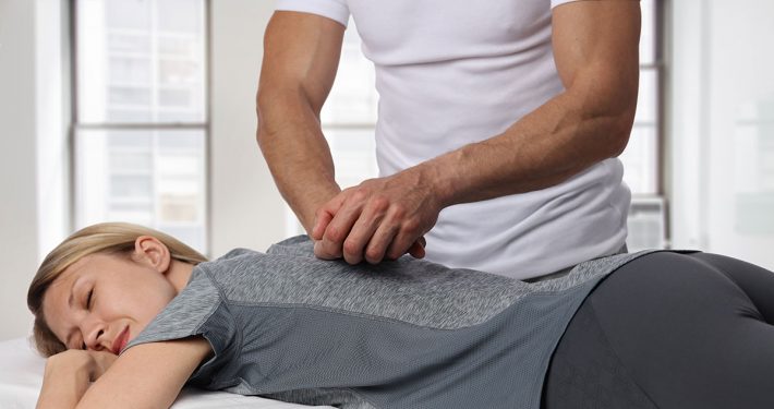 Woman receiving a chiropractic adjustment